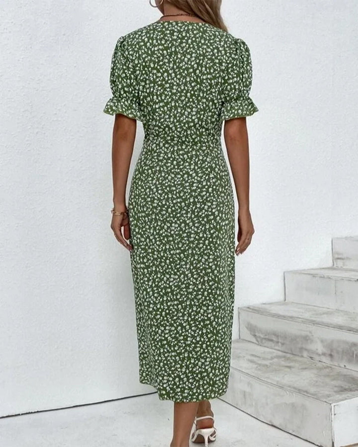 Stylish women’s formalwear with a refined silhouette on a plain background.
