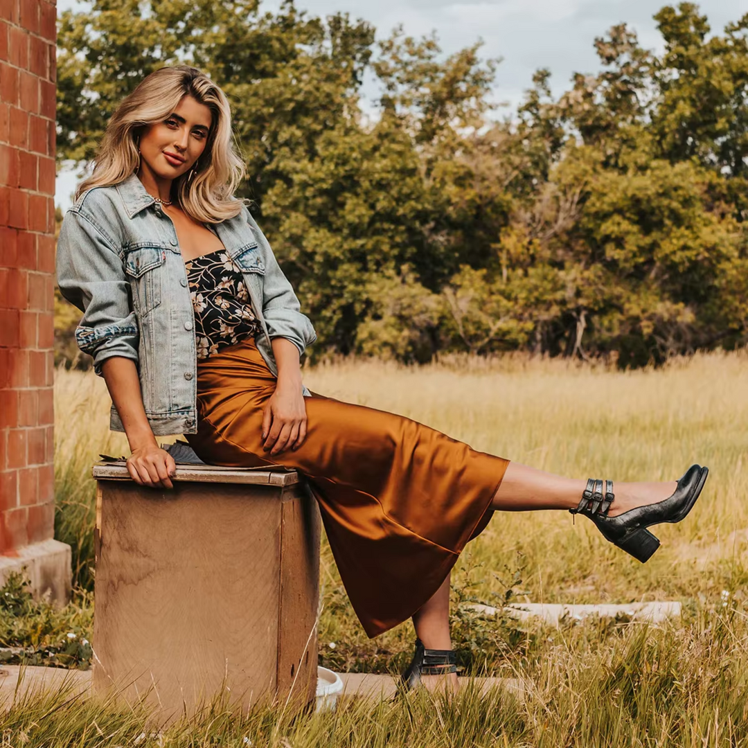 Stylish woman wearing a black sandals with stable heels