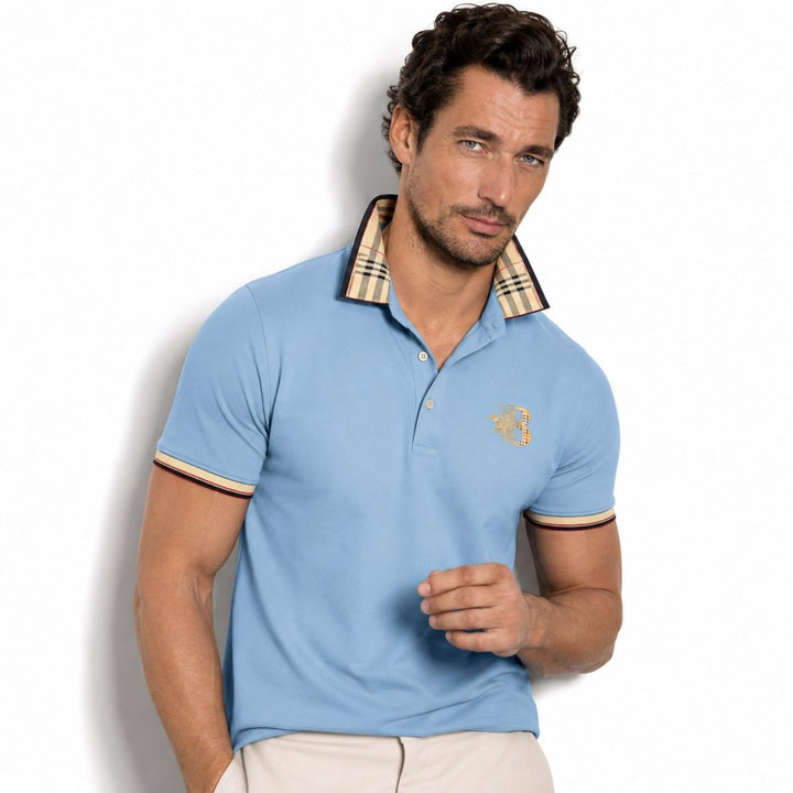  Model showcasing a polished polo shirt with contrast button placket on a plain background.