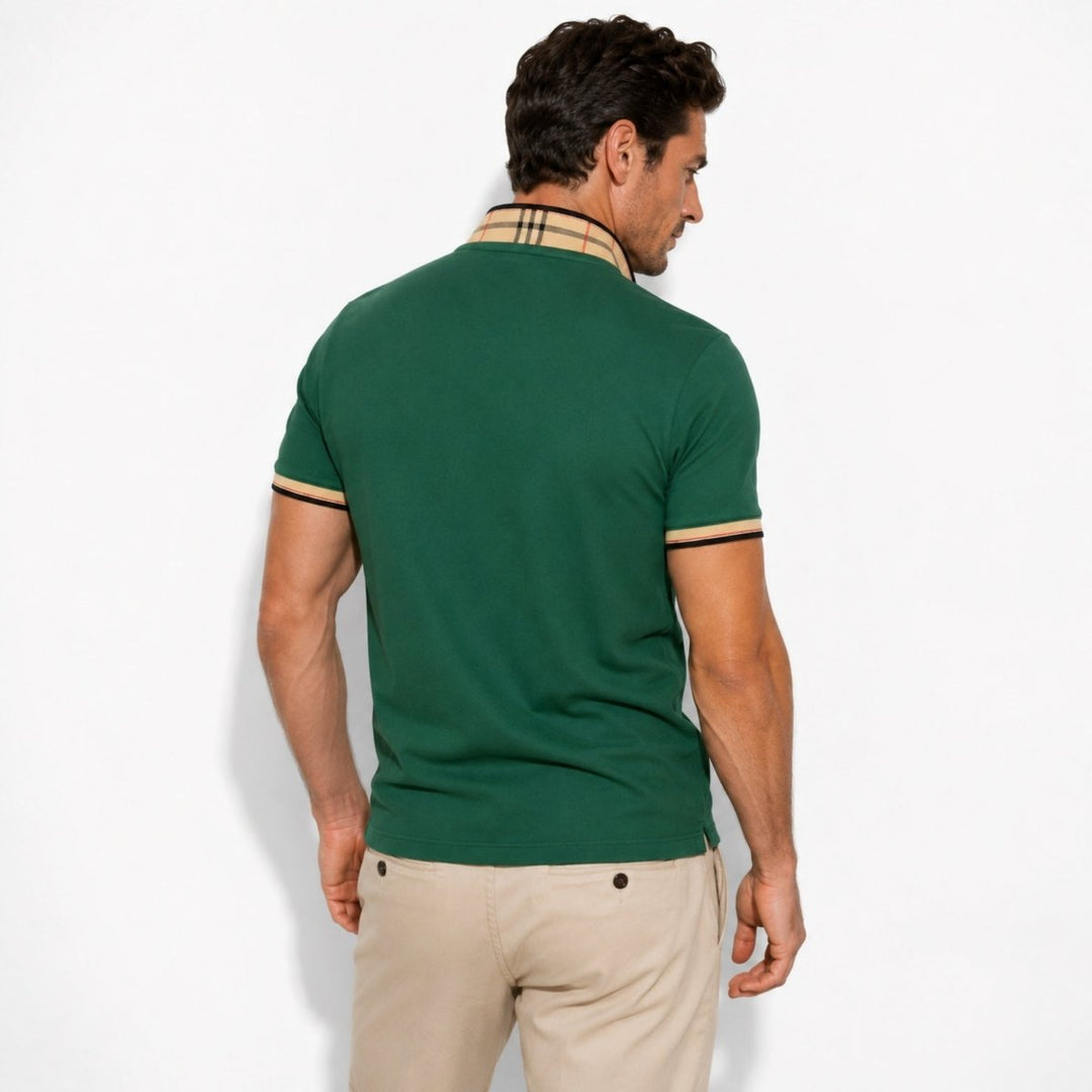  Model showcasing a casual polo shirt with neat collar accents on a plain background.