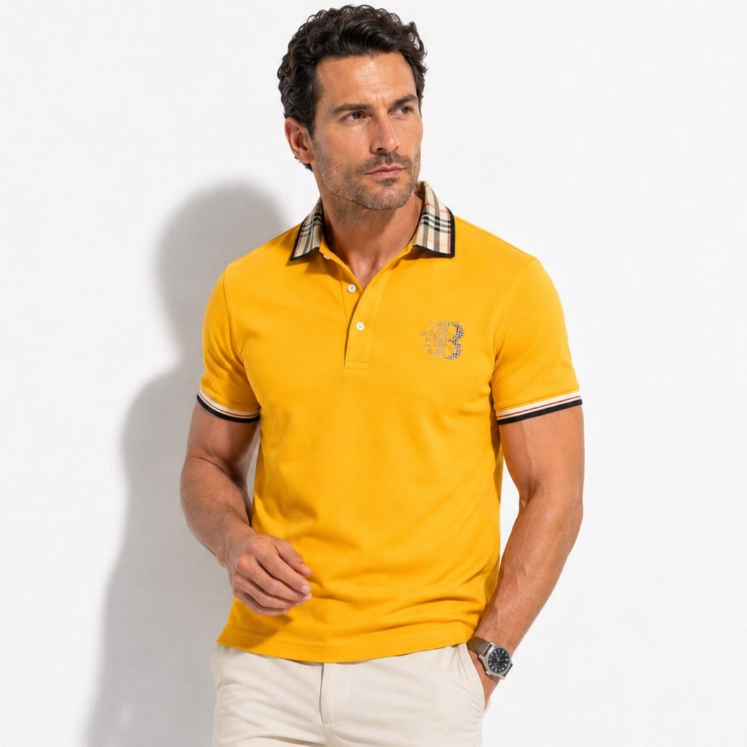  Model wearing a navy polo shirt with button front design on a plain background.