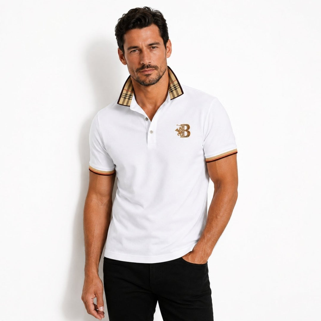  Model wearing a men’s polo shirt with embroidered chest detail on a plain background.