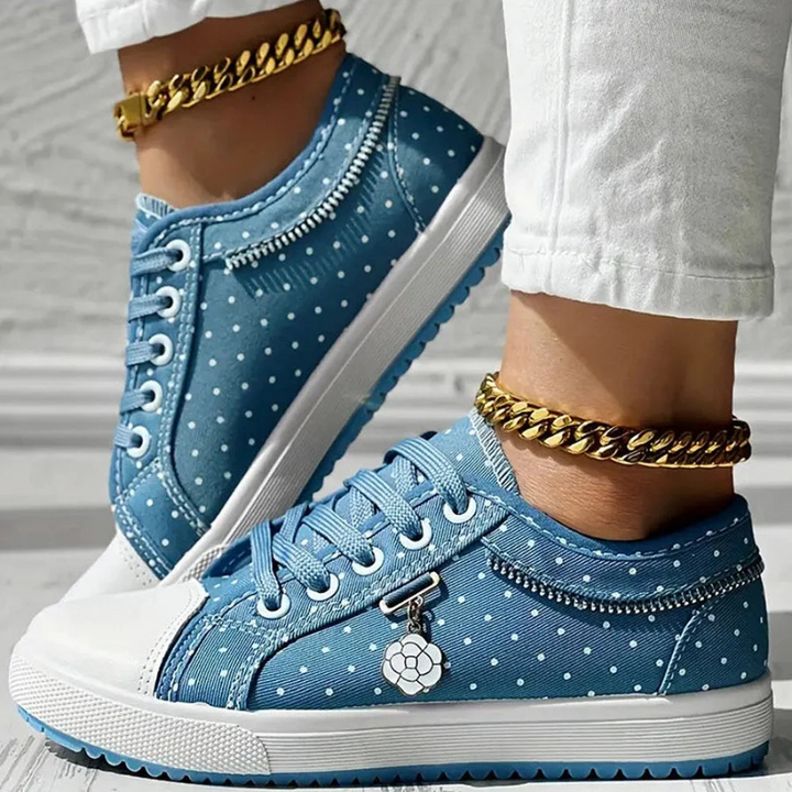 Low cut blue dotted shoes with white rubber sole 