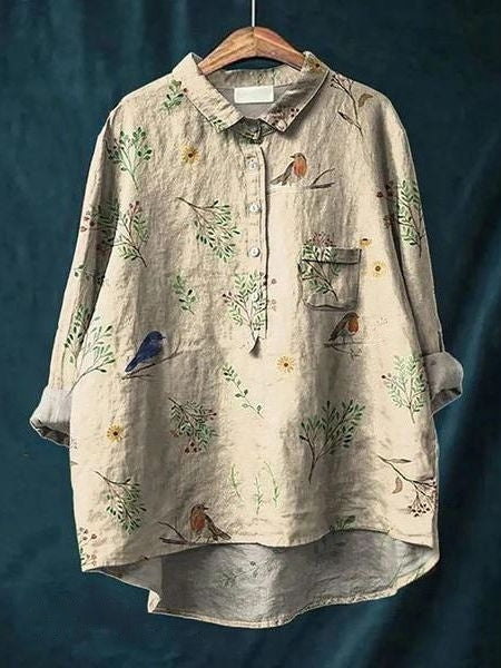 Summer floral blouse with front buttons and pocket detail.