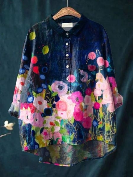 Vibrant floral casual blouse shown against a plain background.