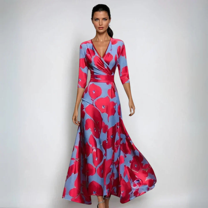 Woman model wearing a floral wrap maxi dress on a plain background.