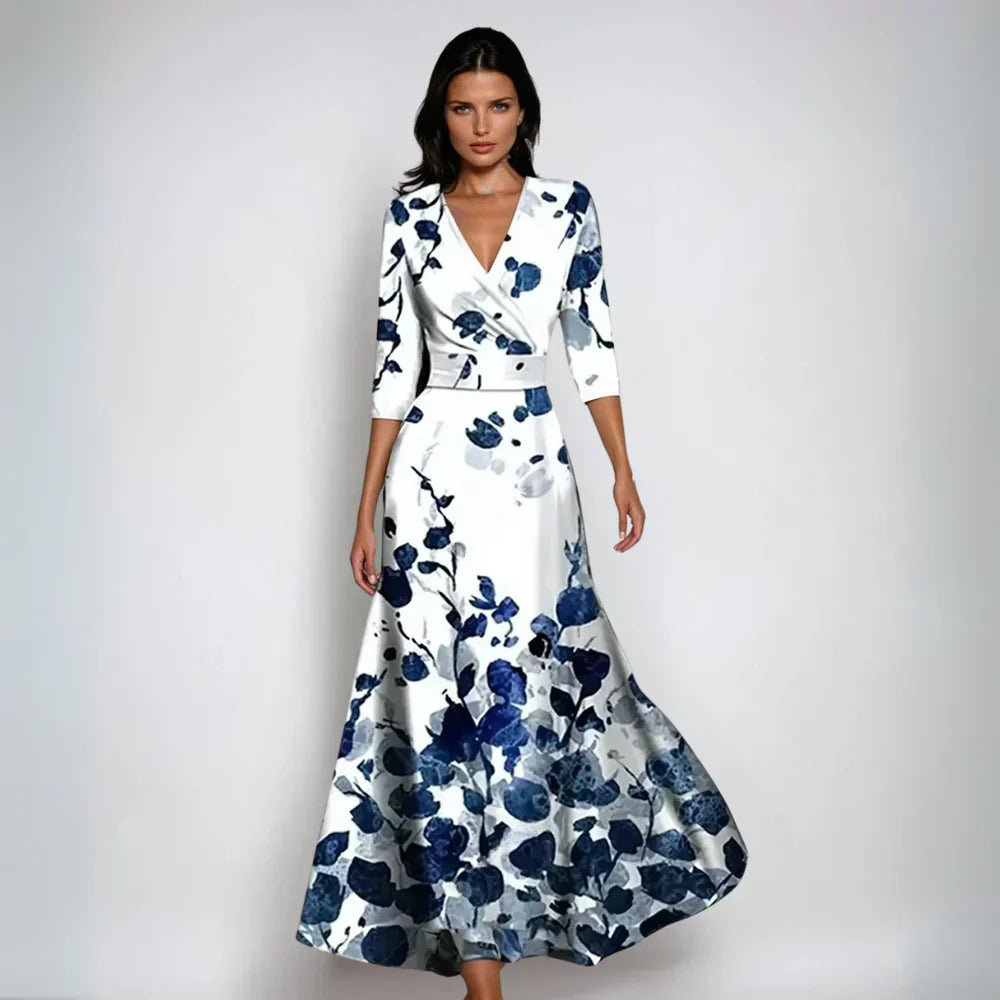 Model in an elegant floral wrap maxi dress against a clean background.
