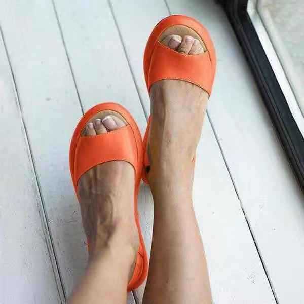 Close up front view of sandals on foot white background