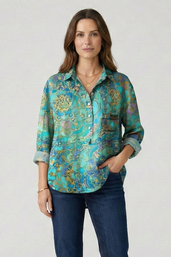 Model in geometric bloom long sleeve floral blouse outfit neutral background