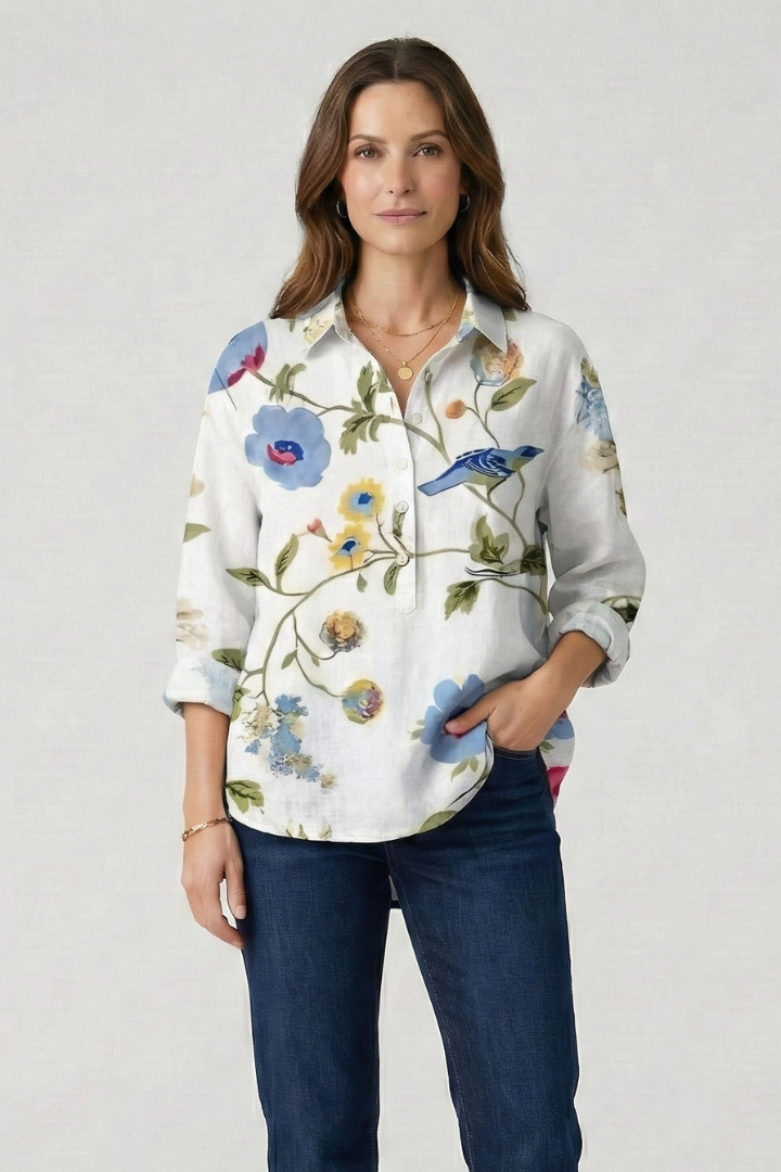 Model in floral blouse and pants backdrop fashion product display