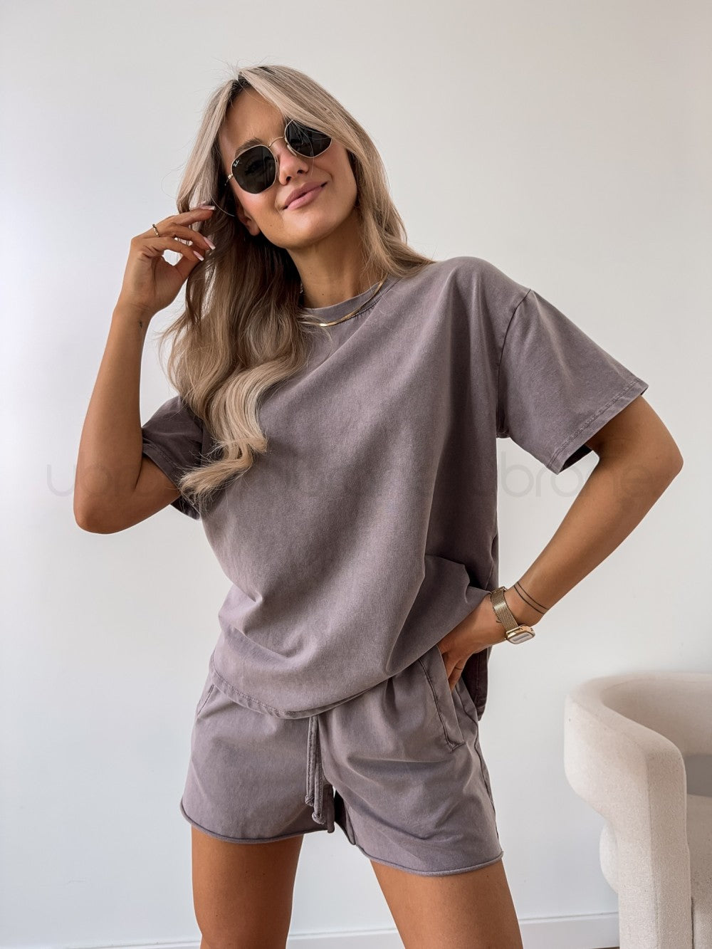 Woman model styling lightweight breathable two piece outfit.