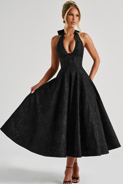 Summer party dress with sleeveless halterneck styling.
