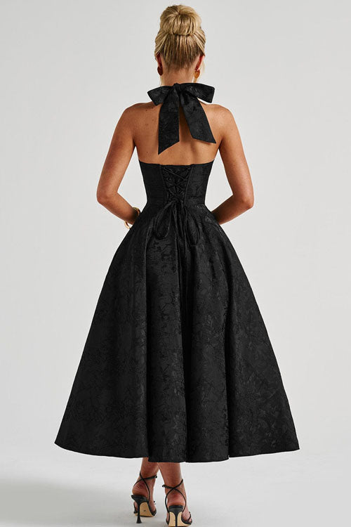 Halterneck jacquard dress displayed without a model.