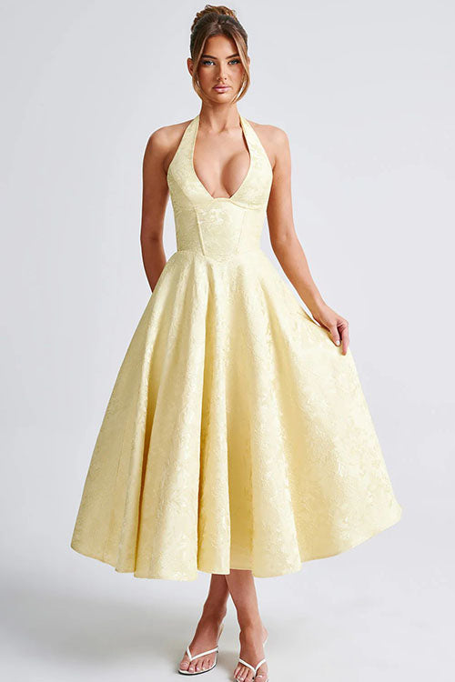 Flared summer celebration dress with halterneck neckline.