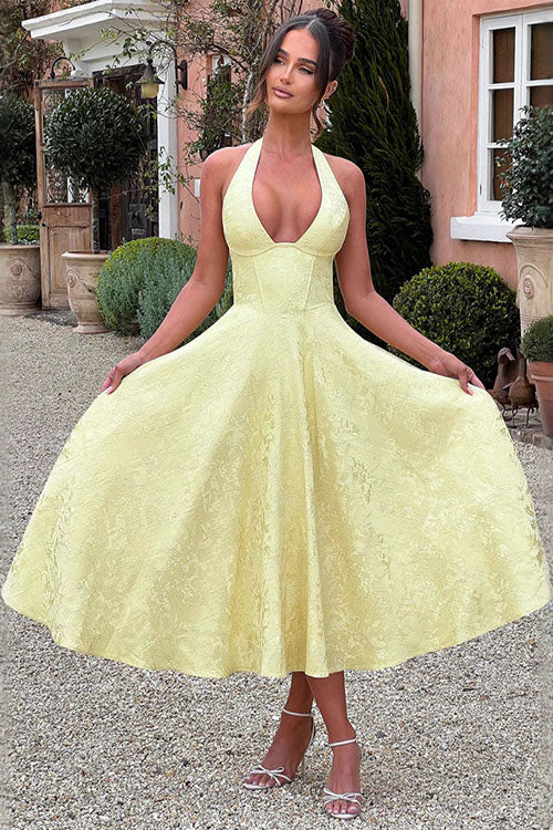 Sleeveless jacquard party dress displayed on a plain background.
