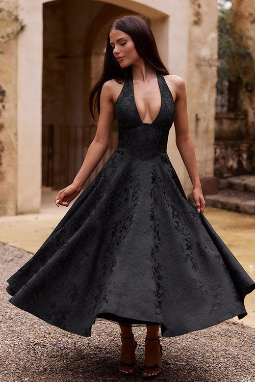Women’s event dress with full skirt and polished shape.