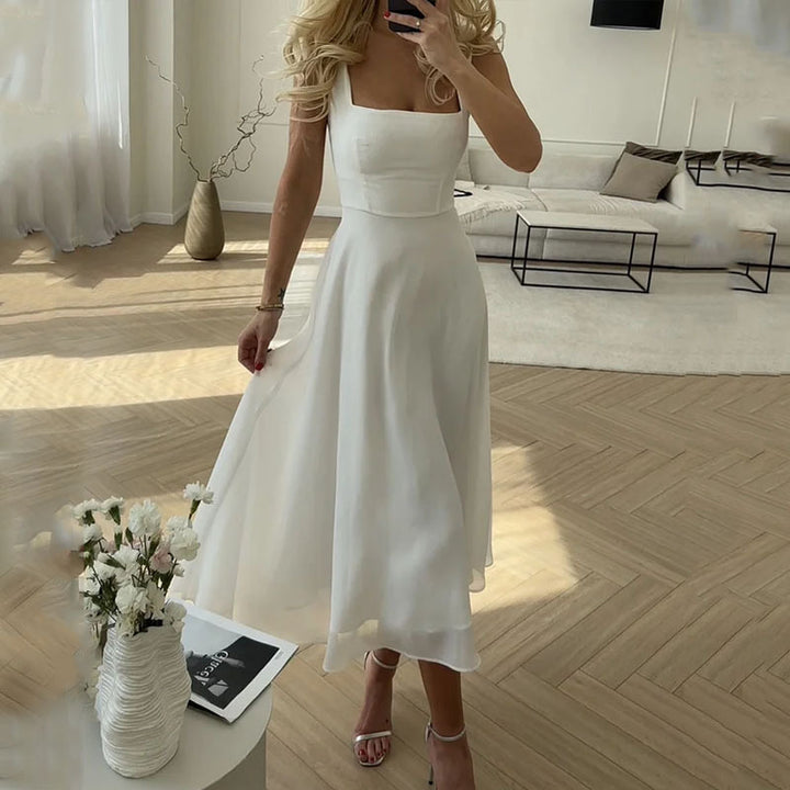 Female model front pose midi dress living space background natural lighting