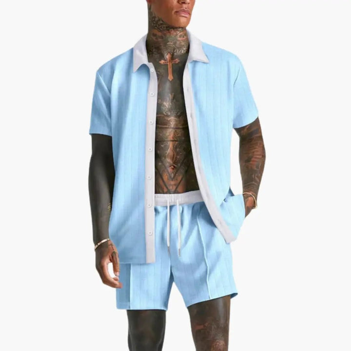  Model in a men’s casual shirt and shorts set with drawstring waist on a plain background.