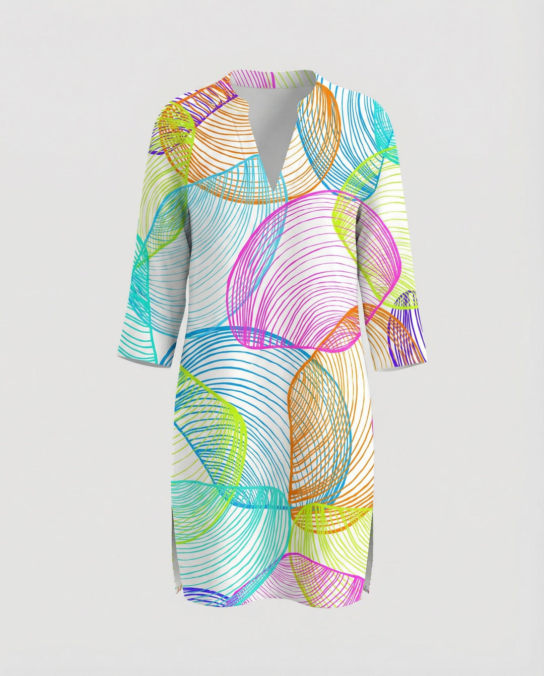 Woman wearing a long holiday blouse with an eye-catching sea-inspired print.