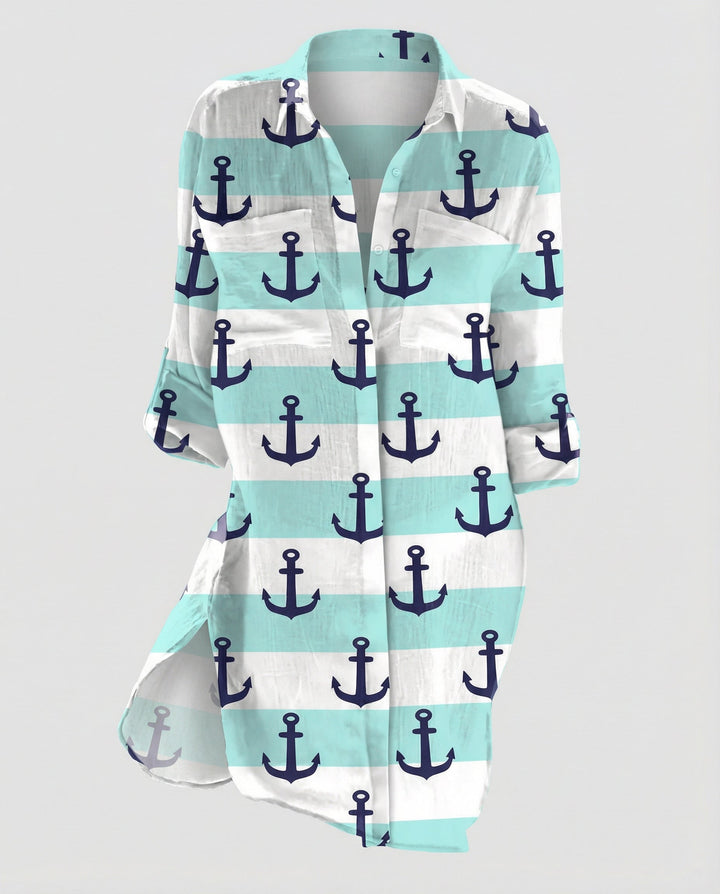Female model in a loose-fitting beach shirt with marine artwork and half sleeves.