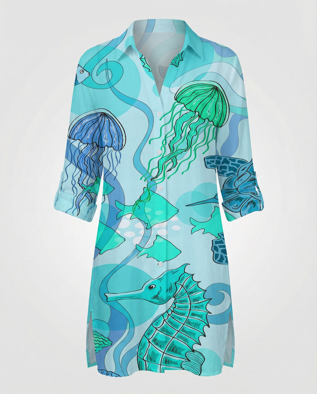 Female model wearing a beach cover-up with an ocean-themed print and half-sleeve styling.