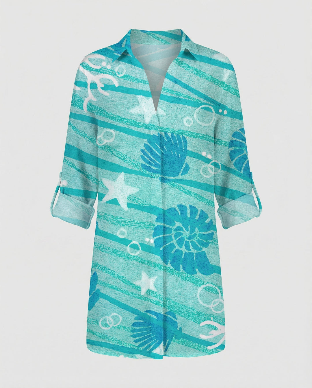 Woman in a lightweight holiday shirt featuring a colourful maritime-inspired pattern.