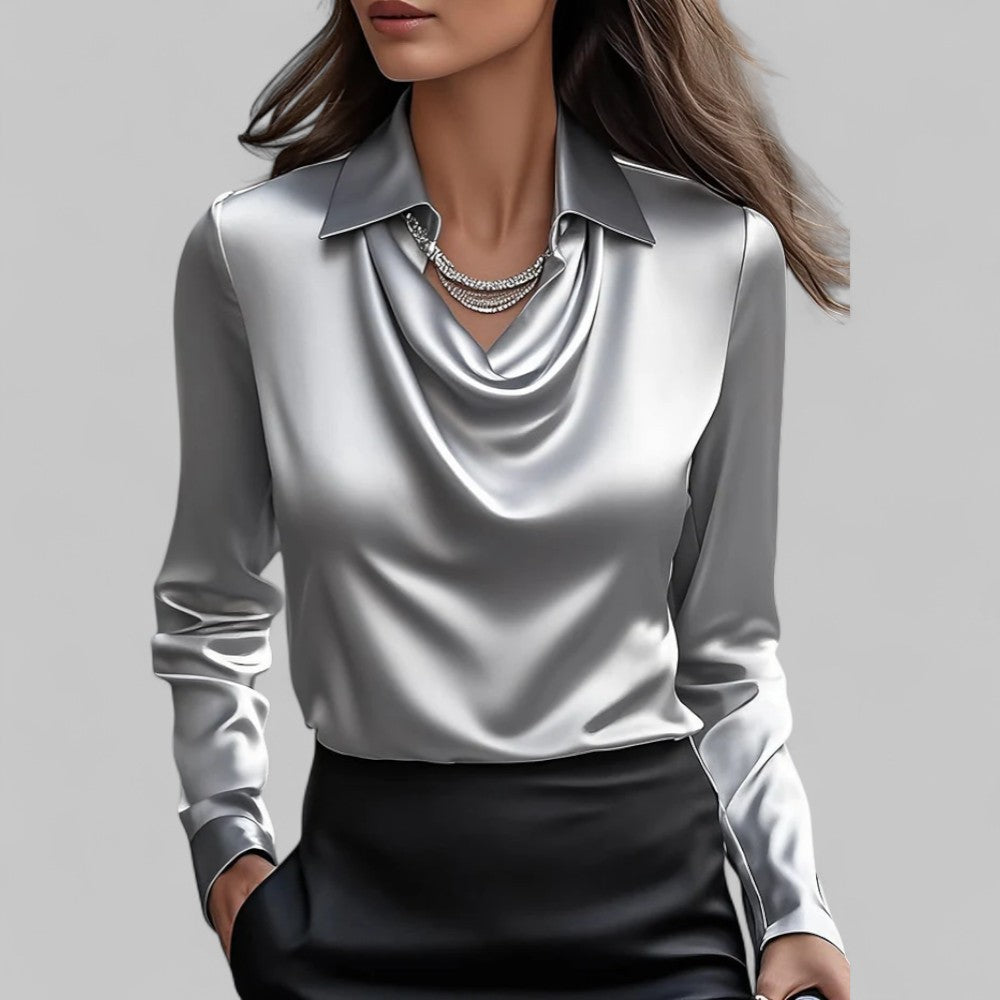 Elegant satin blouse worn by a woman model against a plain background.