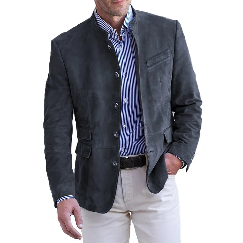  Male model showcasing a tailored blazer with a modern stand collar on a plain background.