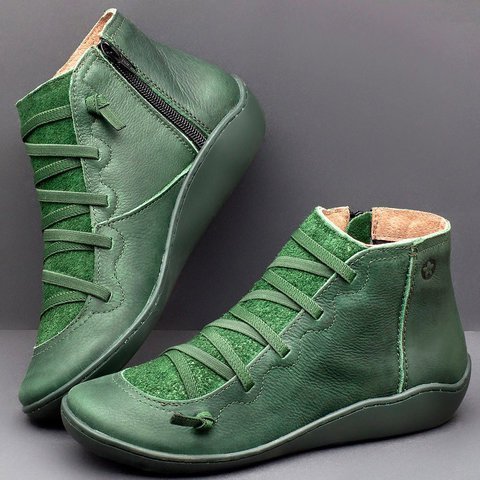 Green high-top shoes on a gray background