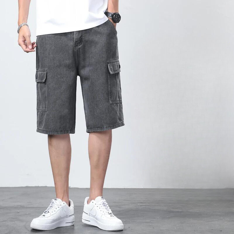 Model showcasing casual spring cargo shorts with side and back pockets on a plain background.