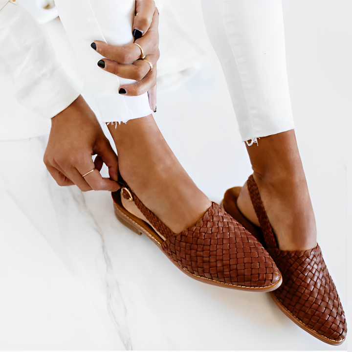 Sleek women’s shoe side view on plain white background display