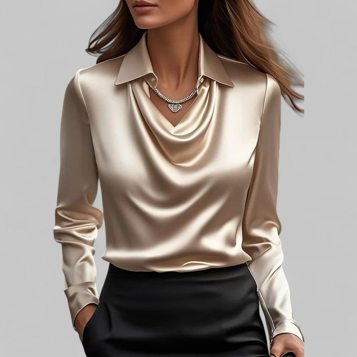 Long sleeve satin blouse with feminine draped neckline on a woman model.