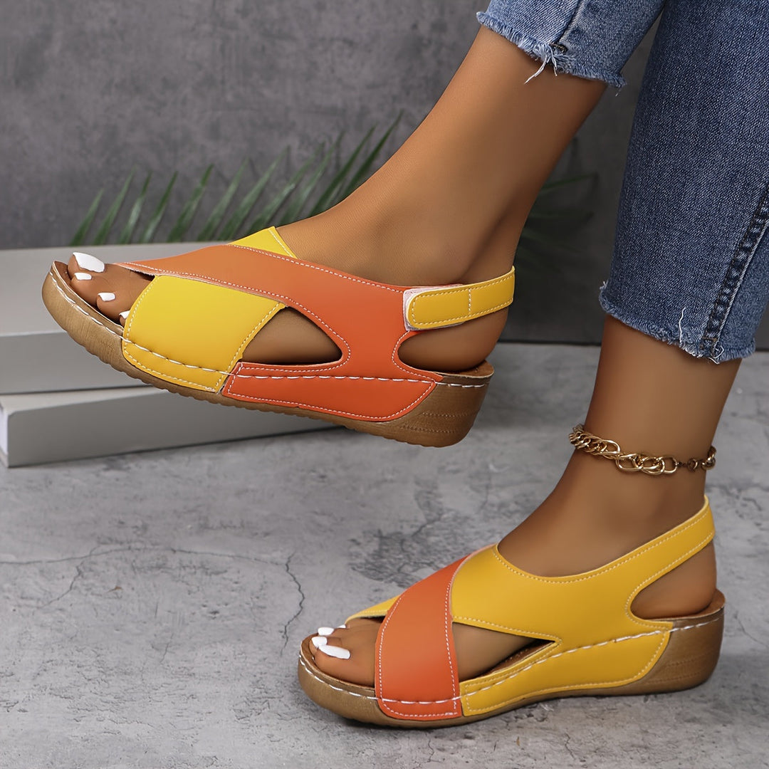 Woman wearing cushioned walking sandals on a plain background