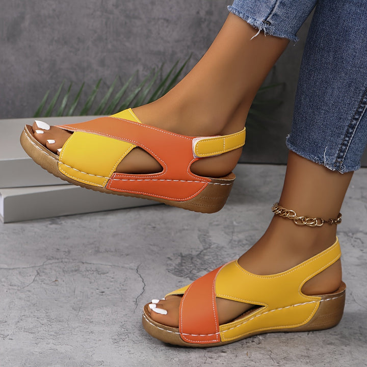 Woman wearing cushioned walking sandals on a plain background