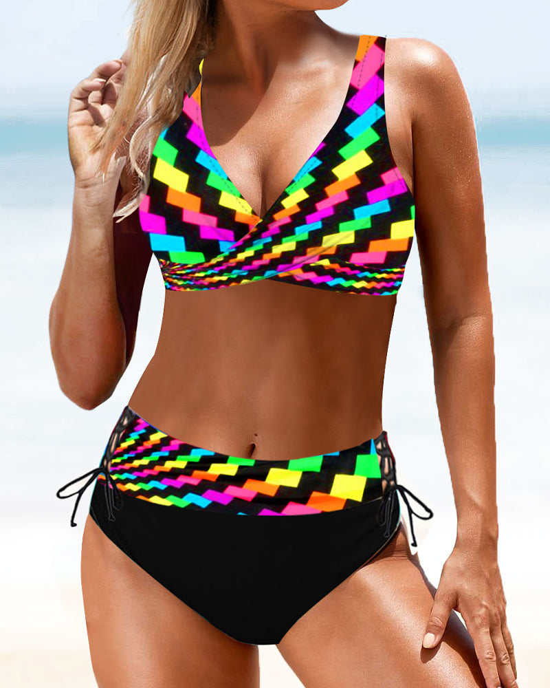 Female model in a bright bikini standing against a beach background for vacation swim style.
