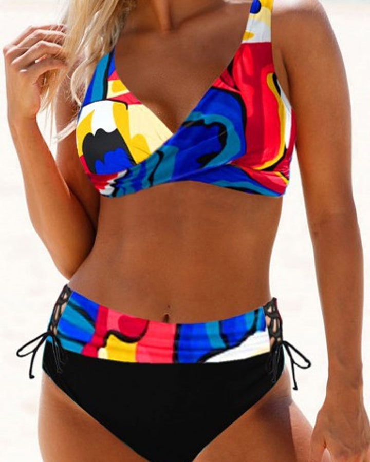 Woman in a colorful two-piece swimsuit on a clean beach background for sunny day style.