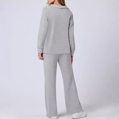 Woman styled in a modern two piece casual set against a plain background.