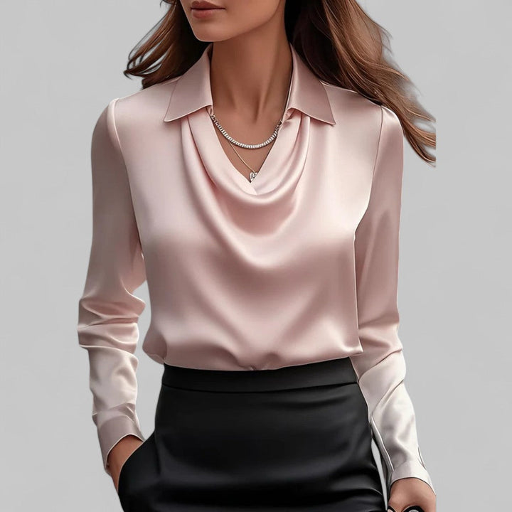 Woman model in a sophisticated long sleeve satin blouse for formal styling.