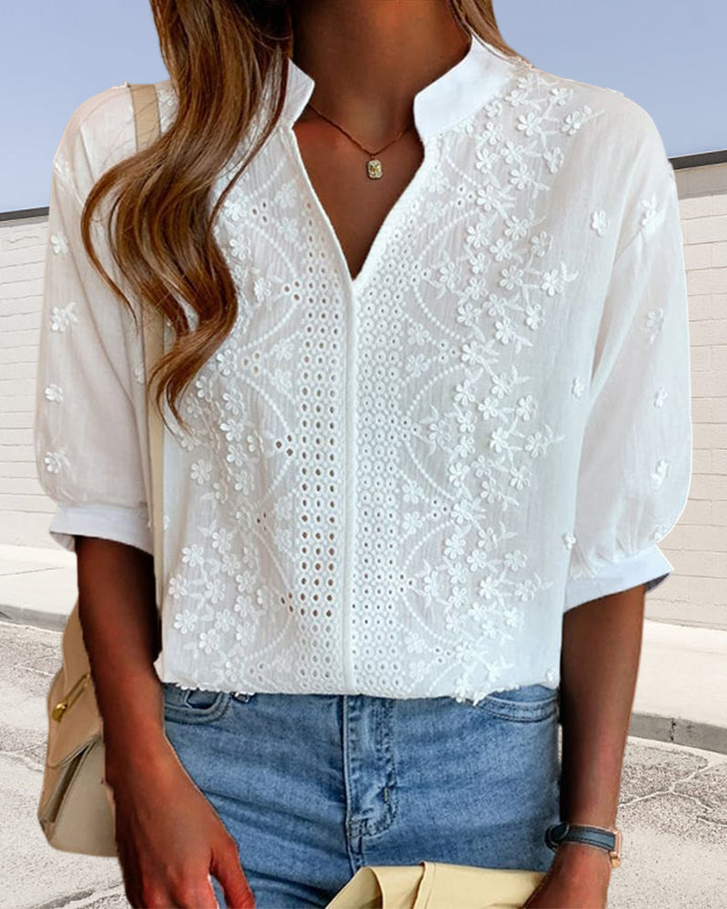 Lightweight puff sleeve blouse with V neckline on a plain background.