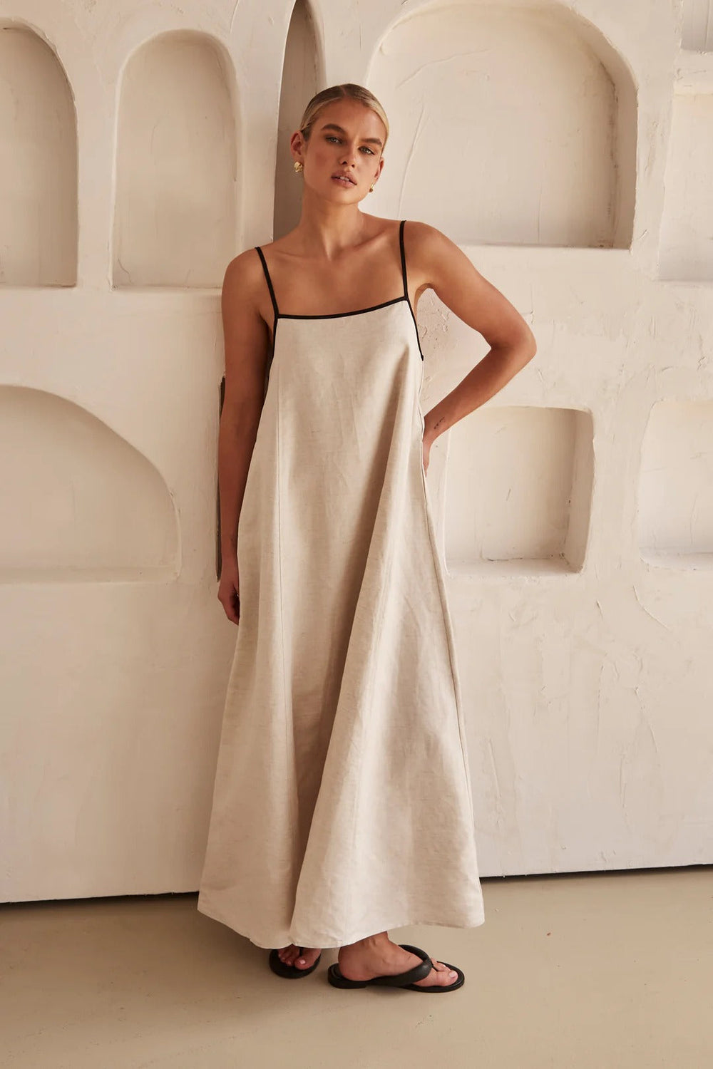 Female model front angle showing elegant long dress minimal design