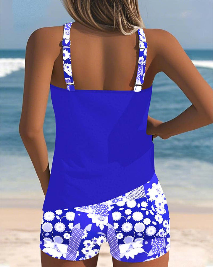 Model wearing a modern swimsuit set on a clean beach background, back view