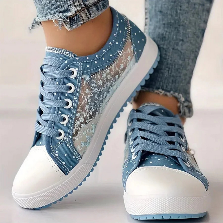 Side view of blue dotted shoes with lace
