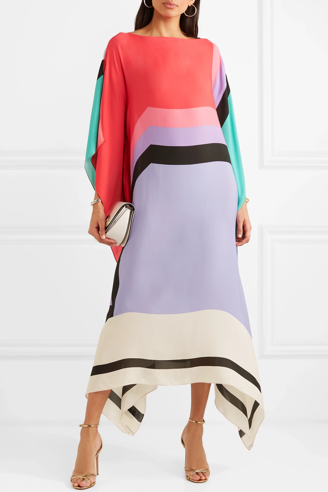 Oversized geometric kaftan styled on a model against a clean background.
