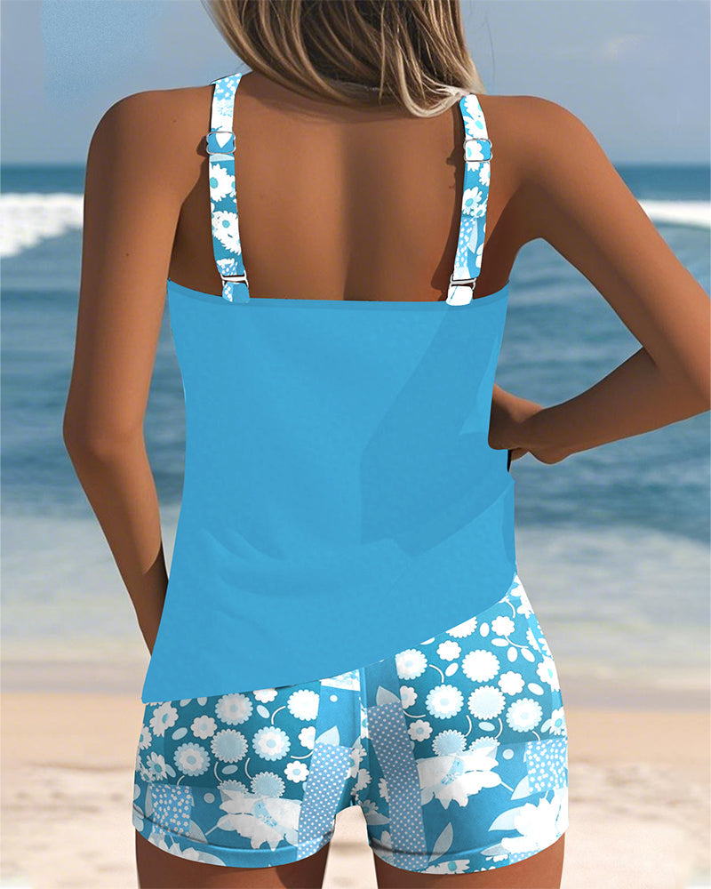 Female model wearing vacation swimwear on a plain beach setting, back view