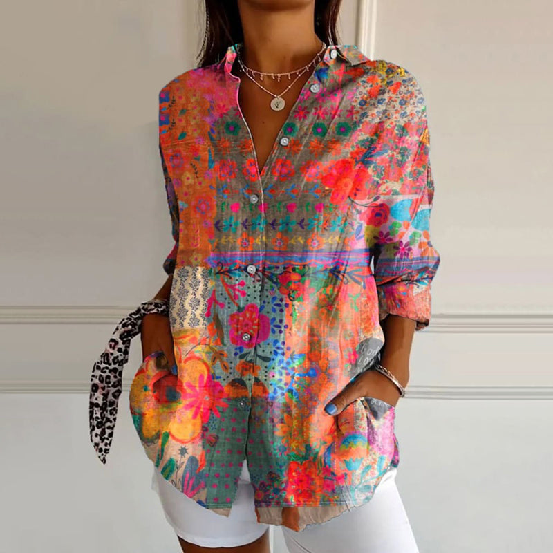 Woman model wearing the Tatiana floral print blouse against a plain background.
