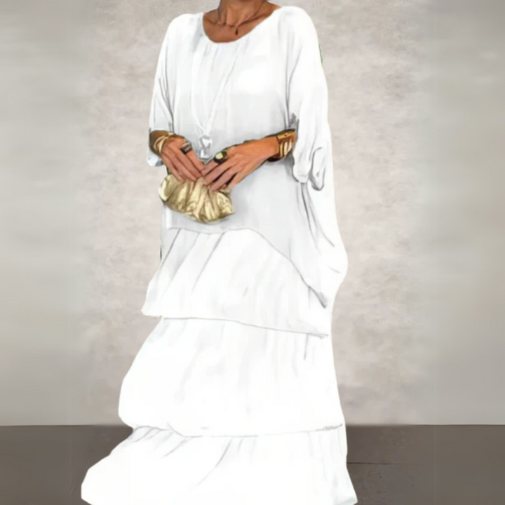 Long white flowy layered ruffle dress with relaxed boho styling
