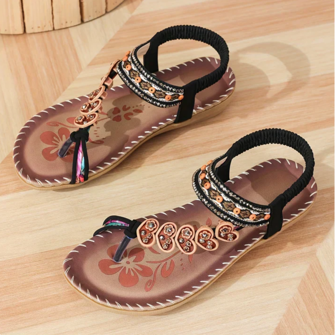 Fashionable sandals with a sleek and modern look on a plain background.