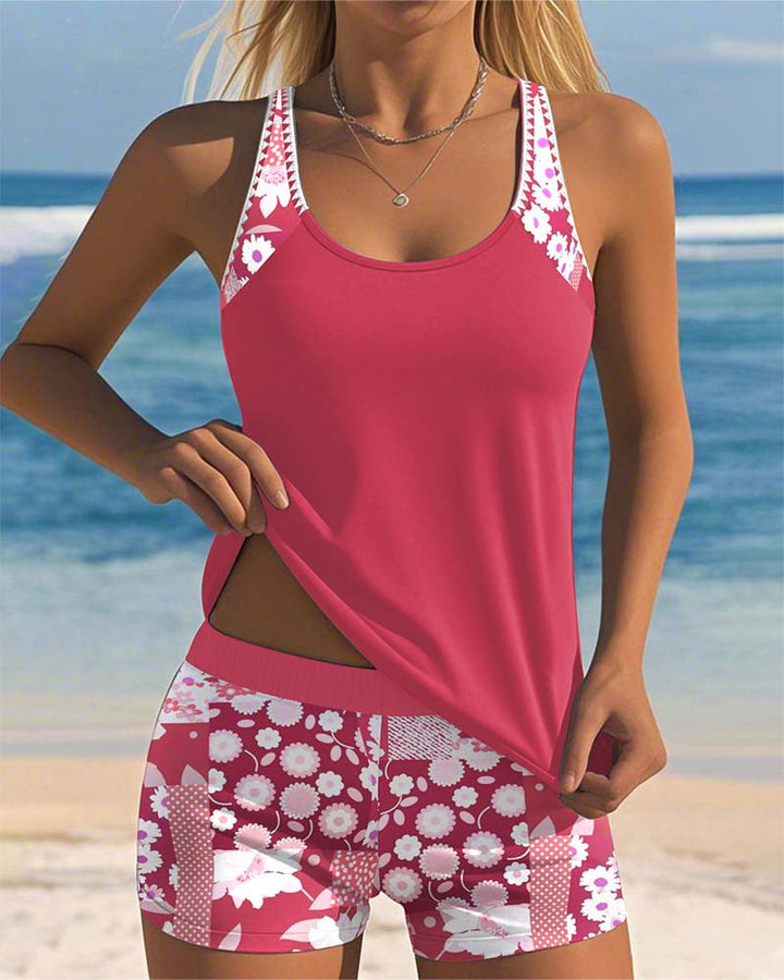 Female model in a coordinated swim outfit on a plain beach background.