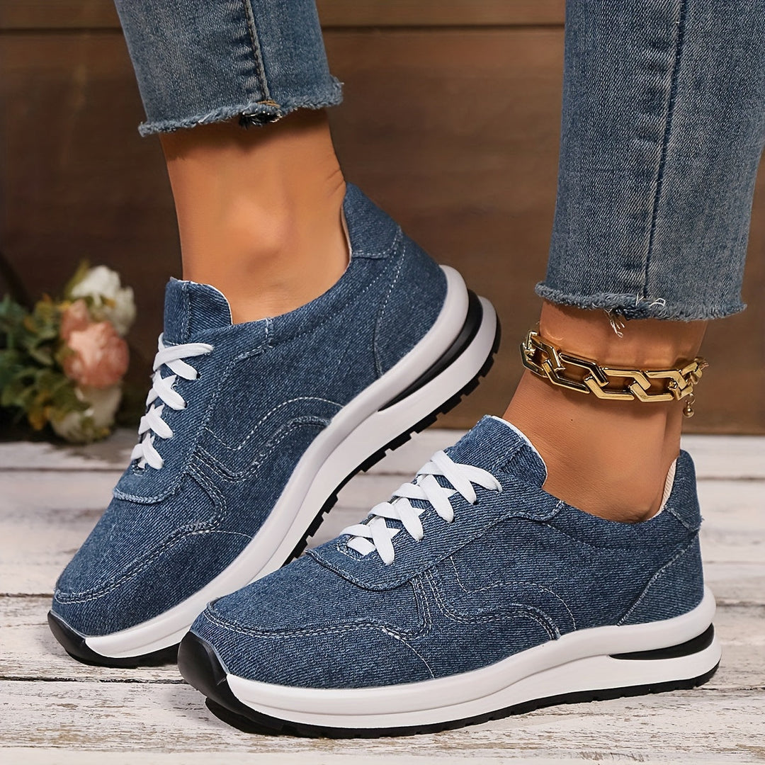 Blue denim sneakers with white laces front view