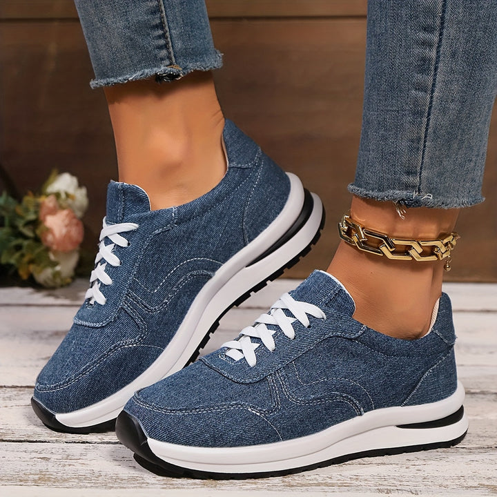 Blue denim sneakers with white laces front view